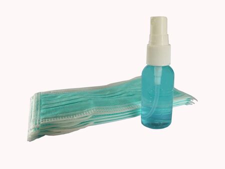 COVID-19 disease (coronavirus) prevention set, medical surgical masks and hand sanitizer alcohol gel in blue colorの写真素材