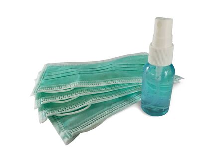 COVID-19 disease (coronavirus) prevention set, medical surgical masks and hand sanitizer alcohol gel in blue colorの写真素材