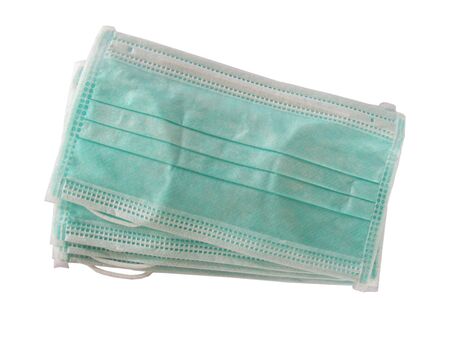 4 pieces of medical protective mask for protection against coronavirus (COVID-19) on white isolatedの写真素材