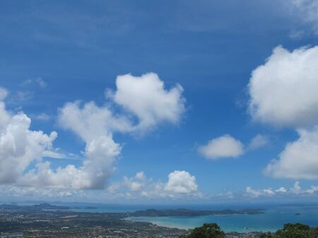                      High view from mountain of coastal town with blue sky and cloudy          の写真素材