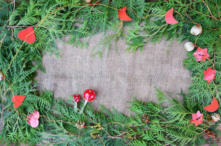 Christmas decorative border on the burlap background