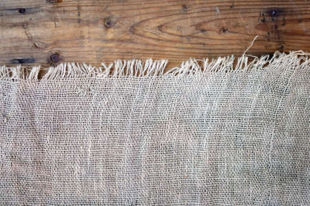 burlap texture on wooden backgroundの写真素材