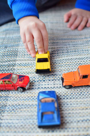 boy playing with toy carsの写真素材
