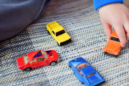boy playing with toy carsの写真素材