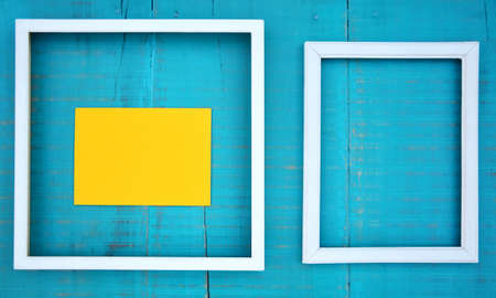 frames on blue wooden backgroundの写真素材