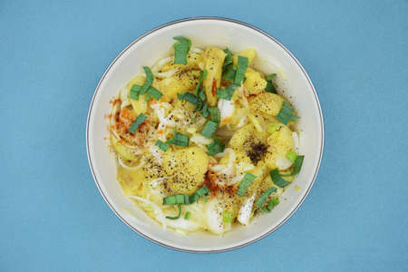 Traditional potato salad, top view. Potato salad with onion and spicesの写真素材