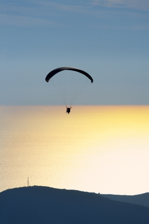 Paraglider in the evening sky, Budva Montenegroの写真素材