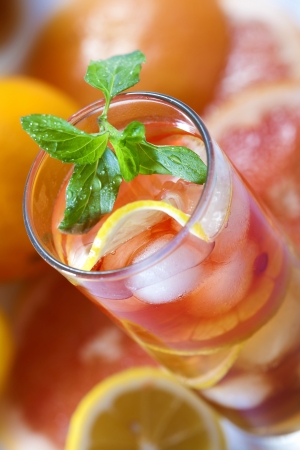 Fresh and cold juice  with sliced grapefruit, lemon and mintの写真素材
