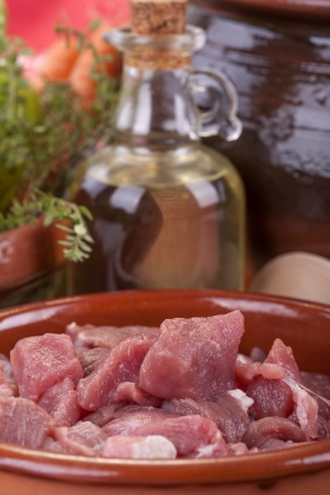 pieces of fresh pork meat ready for cooking in the crock potの写真素材