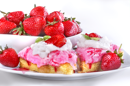 Delicious strawberry cake with ripe fruit in the backgroundの写真素材