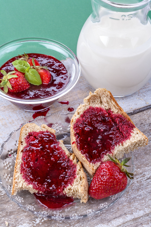 Homemade organic strawberry jam on wholemeal breadの写真素材