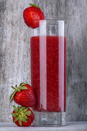 Domestic healthy strawberry juice on rustic tableの写真素材