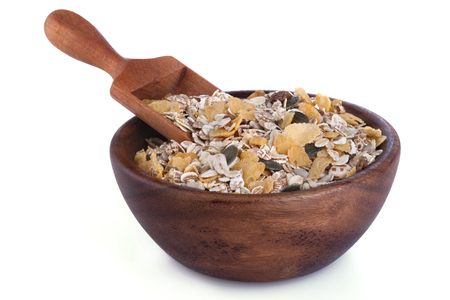 Healthy muesli from different grains in a wooden bowlの写真素材