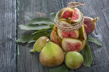 fresh figs on the old wooden table, ready for the preservationの写真素材