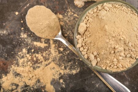 The spice of ginger on the rustic surfaceの写真素材