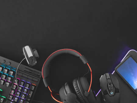 streaming games concept, top view a gaming gear, mouse, Webcams, keyboard, joystick, headset and...