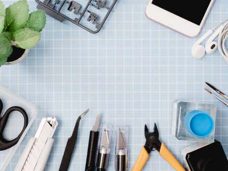 top view of hobbies concept with cutting mat and tool kits on white background with copy space.の写真素材