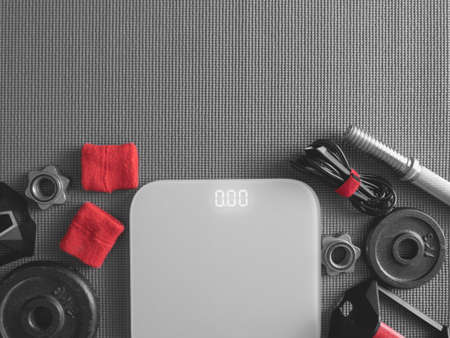 top view of Fitness equipment with Gym Outfit, dumbbells, Sweatband and accessoriesの写真素材