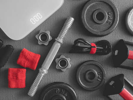 top view of Fitness equipment with Gym Outfit, dumbbells, Sweatband and accessoriesの写真素材