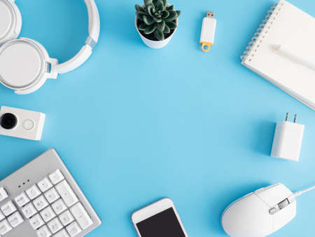 top view of office desk table with mouse on blue table background, graphic designer, Creative Designer concept.の写真素材