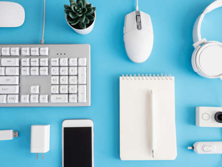 top view of office desk table with mouse on blue table background, graphic designer, Creative Designer concept.の写真素材