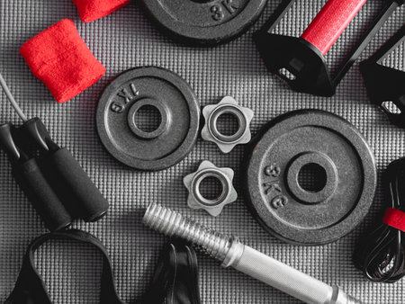 top view of Fitness equipment with Gym Outfit, dumbbells, Sweatband and accessoriesの写真素材
