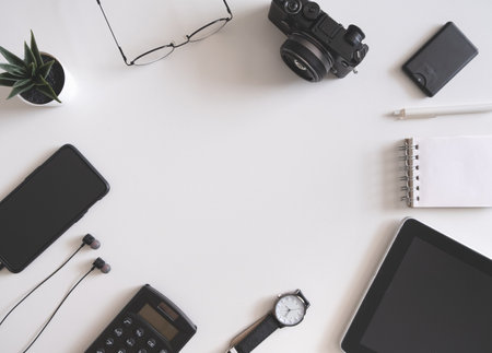 top view of office desk table with tablet and smartphone on white background, graphic designer, Creative Designer concept.の写真素材