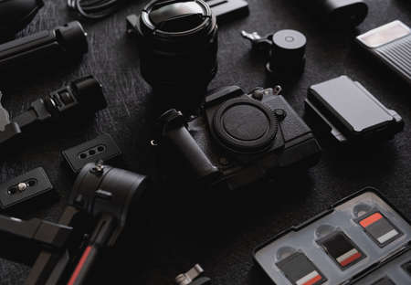 top view of work space photographer with digital camera, Gimbal Stabilizers and camera accessoryの写真素材