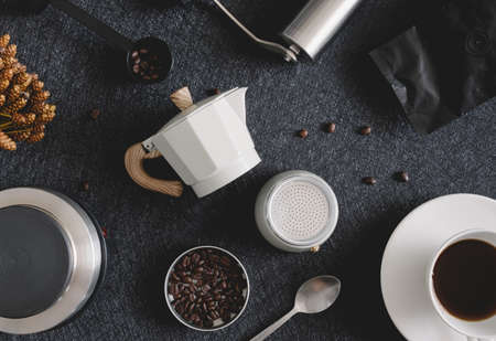 coffee cup and moka pot on black table background in kitchen room, coffee shop.の写真素材