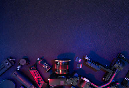 top view of work space photographer with digital camera, Gimbal Stabilizers and camera accessoryの写真素材