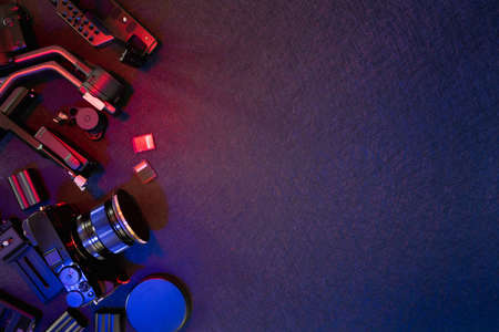 top view of work space photographer with digital camera, Gimbal Stabilizers and camera accessoryの写真素材