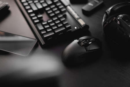 gamer workspace concept, top view a gaming gear, mouse, keyboard and headset