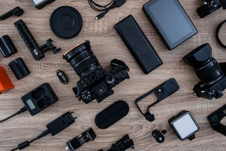 top view of work space photographer with digital camera and camera accessoryの写真素材
