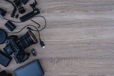 top view of work space photographer with digital camera and camera accessoryの写真素材