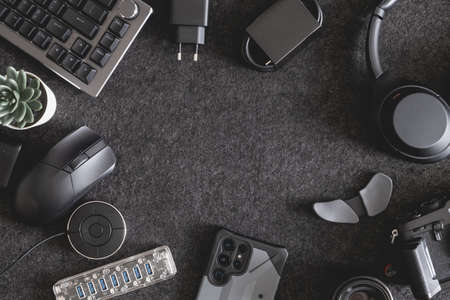top view of home desk table with keyboard, mouse and accessory on table.