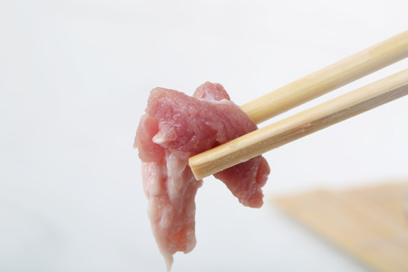 A close-up of the fresh mutton with chopsticksの写真素材