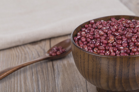 Red Beans in a wooden bowl on the tableの写真素材
