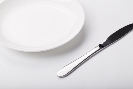 Plate knife and fork on the whiteの写真素材