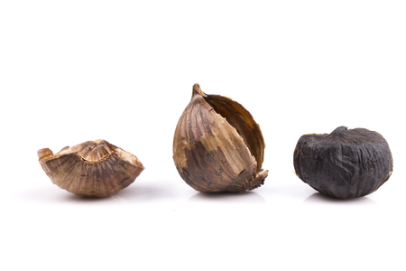 Black garlic isolated on the white backgroundの写真素材