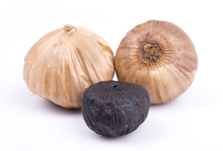 Black garlic isolated on the white backgroundの写真素材