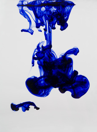 Abstract image of ink flowing in water to make an interesting and unique image.の写真素材
