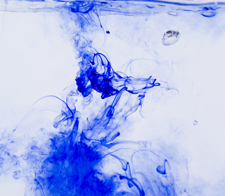 Abstract image of ink flowing in water to make an interesting and unique image.の写真素材