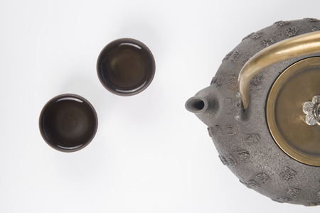Traditional teapot and cups on the white backgroundのeditorial素材