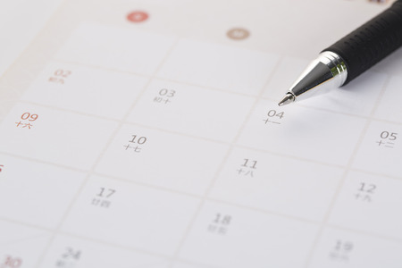 Black pen on an empty calendar.の写真素材