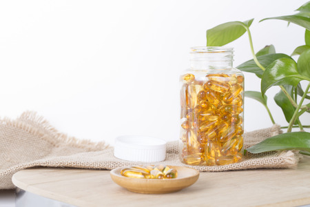 Fish oil capsules on the tableの写真素材