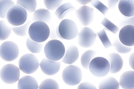 Round white pills on a table.の写真素材