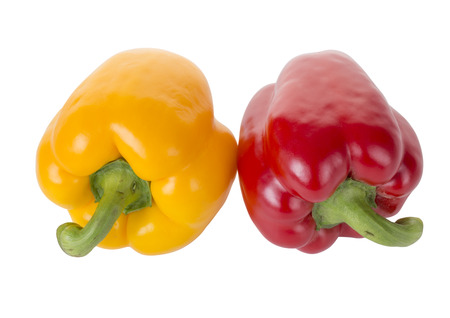 Yellow and red peppers on the white background