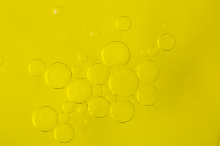 Bubbles of water in olive-oilの写真素材