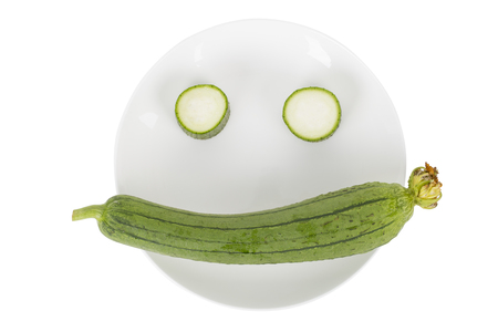 Smiling face from fresh loofah on the white background.の写真素材