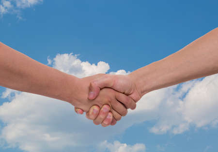 Hand Shake with Cloud background.の写真素材
